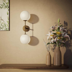 Modern wall light with two frosted glass spheres and vertical brass structure Made in Italy design by Ghidini 1849 - Finish: OBM Bronze Satin Matt Brass
