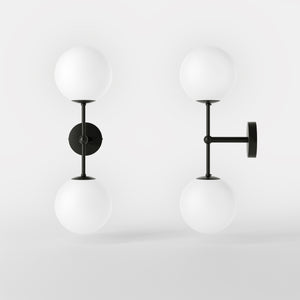 Modern wall light with two frosted glass spheres and vertical brass structure Made in Italy design by Ghidini 1849 - Finish: ONO Matt Black