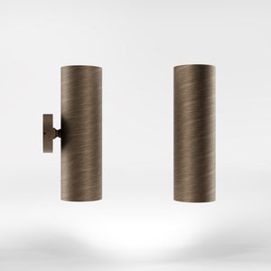 Cylindrical brass wall lamp with up and down light, modern minimalist design by Ghidini 1849 - Finish: OBM Bronze Satin Matt Brass