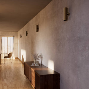 Cylindrical brass wall lamp with up and down light, modern minimalist design by Ghidini 1849 - Finish: OBM Bronze Satin Matt Brass