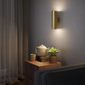 Cylindrical brass wall lamp with up and down light, modern minimalist design by Ghidini 1849 - Finish: OBV Bronze Satin Light Brass