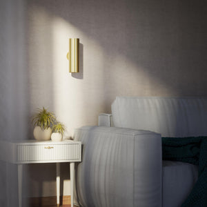 Cylindrical brass wall lamp with up and down light, modern minimalist design by Ghidini 1849 - Finish: OBV Bronze Satin Light Brass