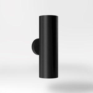 Cylindrical brass wall lamp with up and down light, modern minimalist design by Ghidini 1849 - Finish: ONO Matt Black
