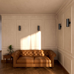 Cylindrical brass wall lamp with up and down light, modern minimalist design by Ghidini 1849 - Finish: ONO Matt Black