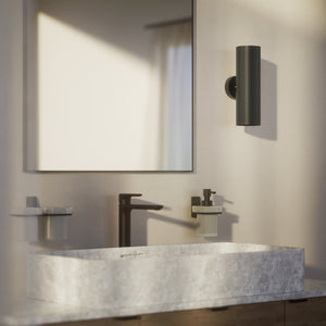 Cylindrical brass wall lamp with up and down light, modern minimalist design by Ghidini 1849 - Finish: ONO Matt Black