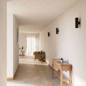 Cylindrical brass wall lamp with up and down light, modern minimalist design by Ghidini 1849 - Finish: ONO Matt Black
