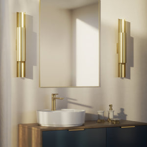 Contemporary brass wall lamp with tubular design, emits light upwards and downwards, ideal for modern spaces by Ghidini 1849 - Finish: OBV Bronze Satin Light Brass