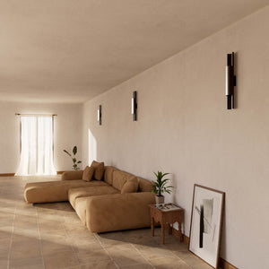 Contemporary brass wall lamp with tubular design, emits light upwards and downwards, ideal for modern spaces by Ghidini 1849 - Finish: ONO Matt Black