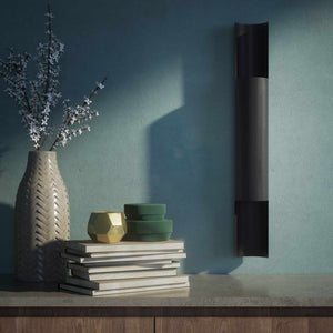 Contemporary brass wall lamp with tubular design, emits light upwards and downwards, ideal for modern spaces by Ghidini 1849 - Finish: ONO Matt Black