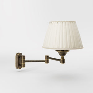 Brass wall lamp with ivory fabric lampshade and adjustable arms for elegant interior spaces by Ghidini 1849 - Finish: OAS Antique Brass