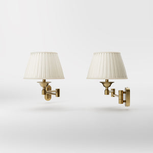 Brass wall lamp with ivory fabric lampshade and adjustable arms for elegant interior spaces by Ghidini 1849 - Finish: OBS Bronze Satin Brass