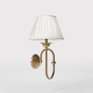 Classic brass wall lamp with curved arm and ivory pleated shade, design inspired by musical instruments Made in Italy by Ghidini 1849 - Finish: OBS Bronze Satin Brass