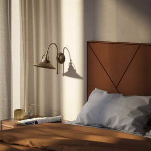 Industrial brass wall lamp with curved arm and adjustable conical shade, vintage style for functional lighting by Ghidini 1849 - Finish: OAS Antique Brass