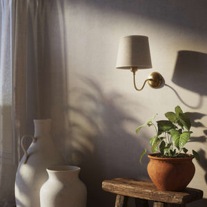 Brass wall light with a grey linen fabric shade, classic design, ideal for elegant and cozy interiors by Ghidini 1849 - Finish: OBS Bronze Satin Brass