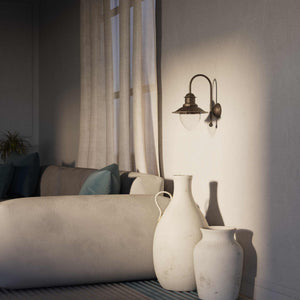 Nautical style wall lamp with curved brass arm and clear glass diffuser, Italian design inspired by ancient port lanterns by Ghidini 1849 - Finish: OAS Antique Brass