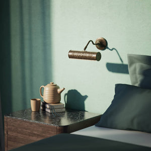 Picture wall lamp in brass with floral relief pattern, adjustable arm and circular base for artwork illumination by Ghidini 1849 - Finish: OAS Antique Brass