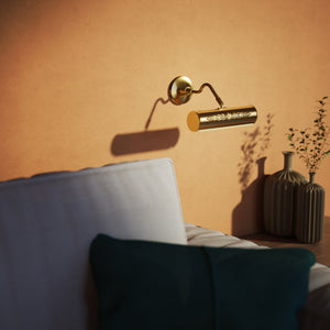 Picture wall lamp in brass with floral relief pattern, adjustable arm and circular base for artwork illumination by Ghidini 1849 - Finish: ORO 24K Gold Plated