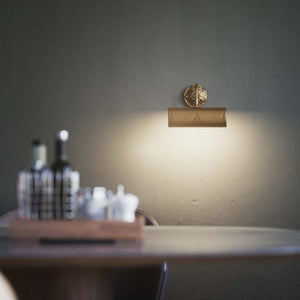 Baroque brass picture wall lamp with ornaments, decorative rosette and adjustable arm for artistic lighting by Ghidini 1849 - Finish: OBS Bronze Satin Brass