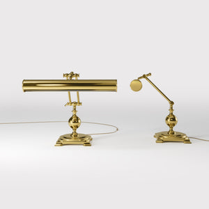 Executive brass desk lamp with cylindrical shade and dual articulation points mounted on decorative square base with spherical accent by Ghidini 1849 - Finish: OLV Polished Brass