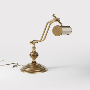 Brass study lamp with adjustable cylindrical shade on turned base with concentric moldings and dual joint system by Ghidini 1849 - Finish: OBS Bronze Satin Brass