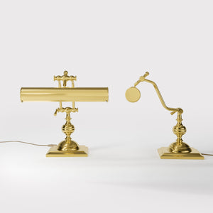 Vintage brass table lamp with adjustable cylindrical shade and articulated arm on square base with turned element by Ghidini 1849 - Finish: OLV Polished Brass