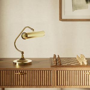 Art Deco brass table lamp with fluted cylindrical shade and adjustable joint on radially ribbed base by Ghidini 1849 - Finish: OLV Polished Brass