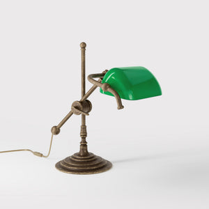 Mini brass desk lamp with green glass shade sliding arm on stem and turned circular base by Ghidini 1849 - Finish: OAS Antique Brass
