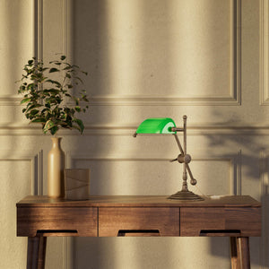 Mini brass desk lamp with green glass shade sliding arm on stem and turned circular base by Ghidini 1849 - Finish: OAS Antique Brass