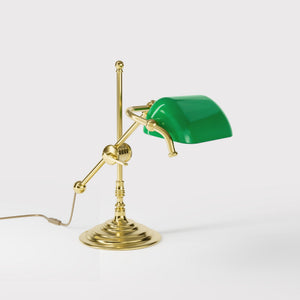 Mini brass desk lamp with green glass shade sliding arm on stem and turned circular base by Ghidini 1849 - Finish: OLV Polished Brass
