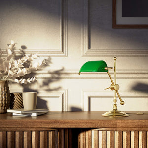 Mini brass desk lamp with green glass shade sliding arm on stem and turned circular base by Ghidini 1849 - Finish: OLV Polished Brass