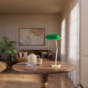 Minimalist table lamp with green glass shade circular brass base slender stem and pull chain by Ghidini 1849 - Finish: OLV Polished Brass