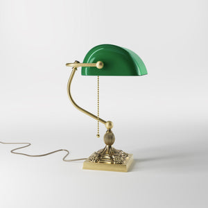 Banker’s lamp in brass with green glass shade, decorative base, and pull-chain switch. Elegant desk or decorative lighting by Ghidini 1849 - Finish: OBV Bronze Satin Light Brass