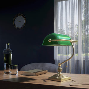 Banker’s lamp in brass with green glass shade, decorative base, and pull-chain switch. Elegant desk or decorative lighting by Ghidini 1849 - Finish: OBV Bronze Satin Light Brass