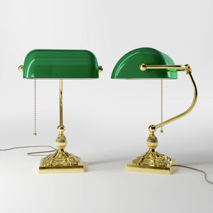 Banker’s lamp in brass with green glass shade, decorative base, and pull-chain switch. Elegant desk or decorative lighting by Ghidini 1849 - Finish: OLV Polished Brass