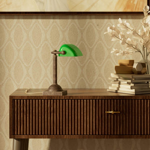 Compact banker's lamp with green glass shade and brass structure, square base and essential design by Ghidini 1849 - Finish: OAS Antique Brass