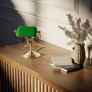 Small banker's lamp with green shade, adjustable brass arm and turned stepped base by Ghidini 1849 - Finish: OLV Polished Brass