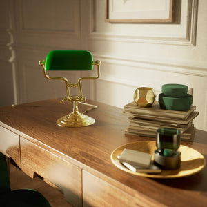 Small banker's lamp with green shade, adjustable brass arm and turned stepped base by Ghidini 1849 - Finish: OLV Polished Brass