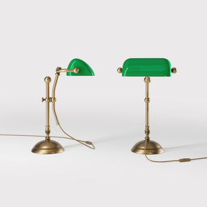 Compact banker's desk lamp with green shade, height-adjustable arm and brass structure by Ghidini 1849 | Finish: OBS Bronze Satin Brass