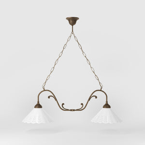 Art Nouveau pendant lamp with two pierced white ceramic shades, decorative brass arms and adjustable suspension chain by Ghidini 1849 - Finish: OAS Antique Brass