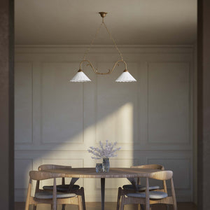 Art Nouveau pendant lamp with two pierced white ceramic shades, decorative brass arms and adjustable suspension chain by Ghidini 1849 - Finish: OAS Antique Brass