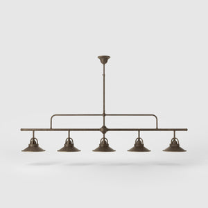 Industrial linear brass pendant with five symmetrical conical shades for dramatic lighting effect by Ghidini 1849 - Finish: OAS Antique Brass
