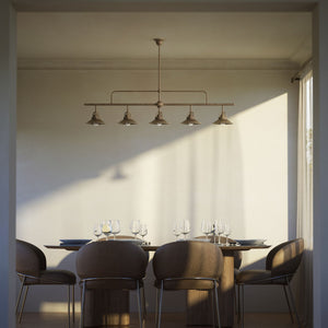 Industrial linear brass pendant with five symmetrical conical shades for dramatic lighting effect by Ghidini 1849 - Finish: OAS Antique Brass