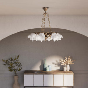 Art Nouveau chandelier with six brass putti and rose-shaped frosted glass shades, decorated chains and floral rosette by Ghidini 1849 - Finish: OAS Antique Brass