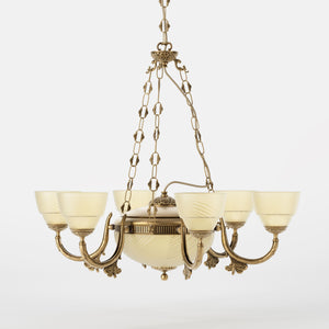Neoclassical brass chandelier with six decorated arms, central bowl and ornamental chains, diamond-patterned frosted glass diffusers by Ghidini 1849 - Finish: OBS Bronze Satin Brass