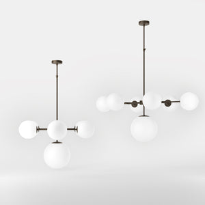 Brass chandelier with white opal glass spheres, ideal for decorative lighting by Ghidini 1849 - Finish: OBM Bronze Satin Matt Brass