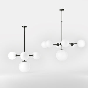 Brass chandelier with white opal glass spheres, ideal for decorative lighting by Ghidini 1849 - Finish: ONO Matt Black