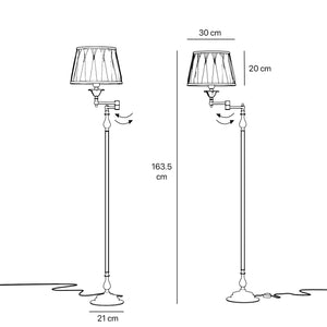 Classic brass floor lamp with adjustable arm, ivory fabric shade, elegant design, and versatile functionality for interiors by Ghidini 1849