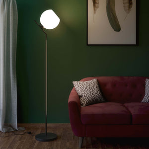 Brass floor lamp with opal glass sphere, tilted design, perfect for contemporary and refined interiors by Ghidini 1849 - Finish: ONO Matt Black