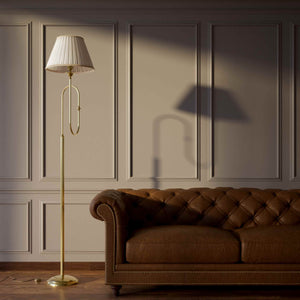 Brass floor lamp with trumpet arm and ivory pleated shade, musical design Made in Italy by Ghidini 1849 - Finish: OLV Polished Brass
