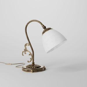 Art Nouveau brass table lamp with a spotted white glass shade and adjustable joint, ideal for elegant spaces by Ghidini 1849 - Finish: OAS Antique Brass